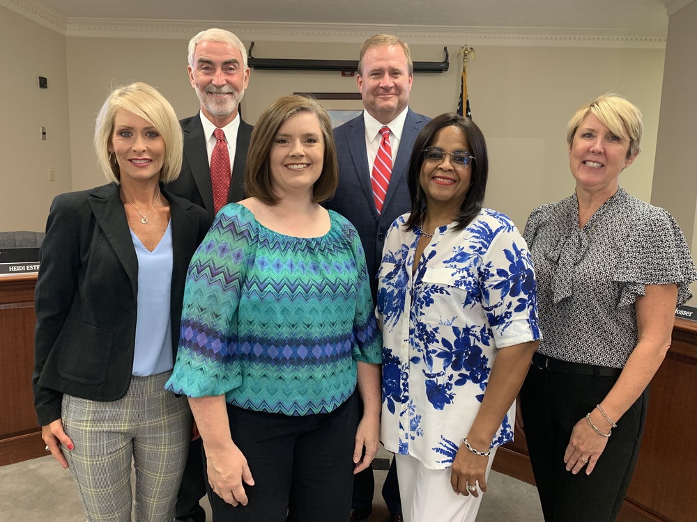 Front Row: Tara Heinze, Jennifer Stone, Nancy Uhls, Heidi Estes  Back Row:  Chairperson David Webster, Superintendent Tim Schlosser 